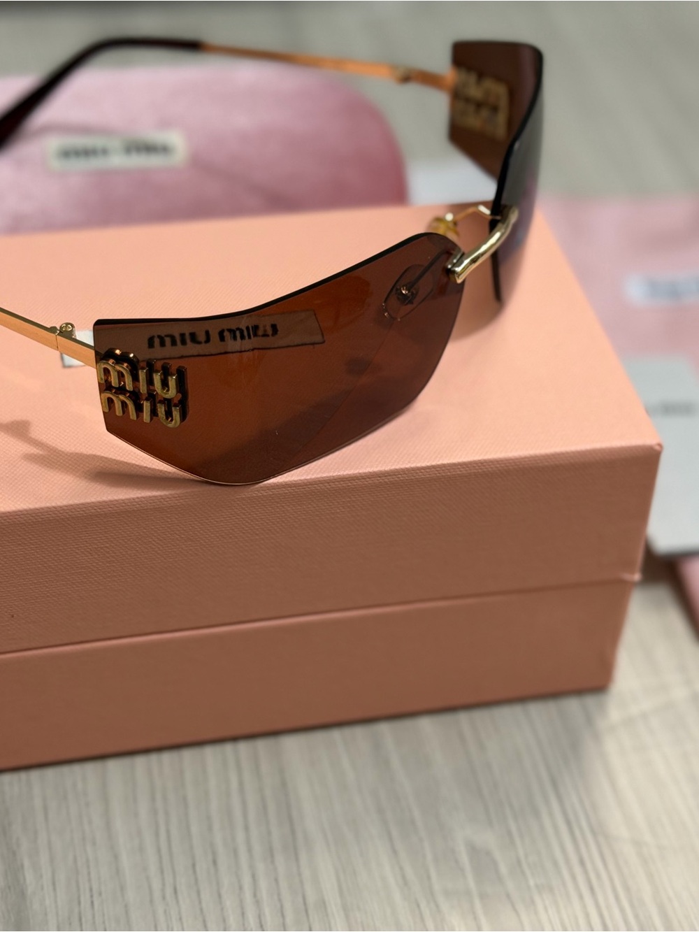 Miu Miu Brown Rimless Sunglasses with Gold Logo Accents